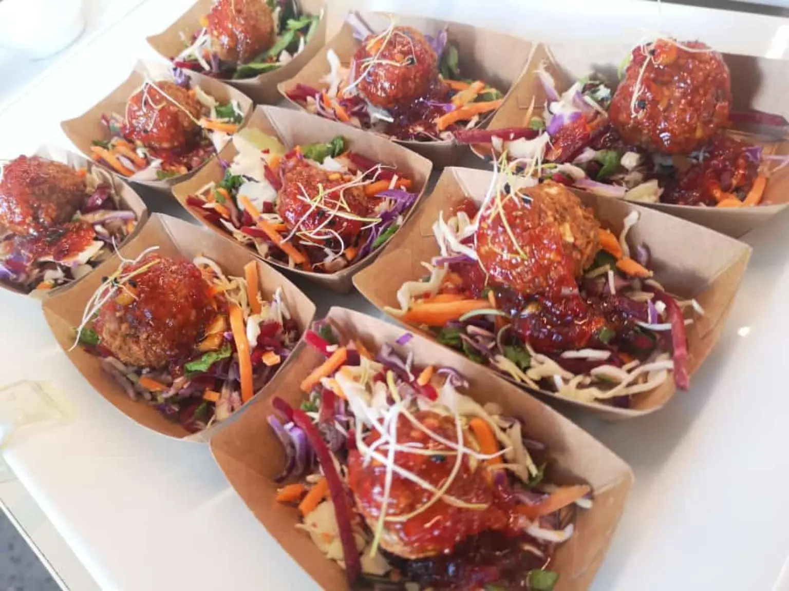Catering bites served with colourful slaw