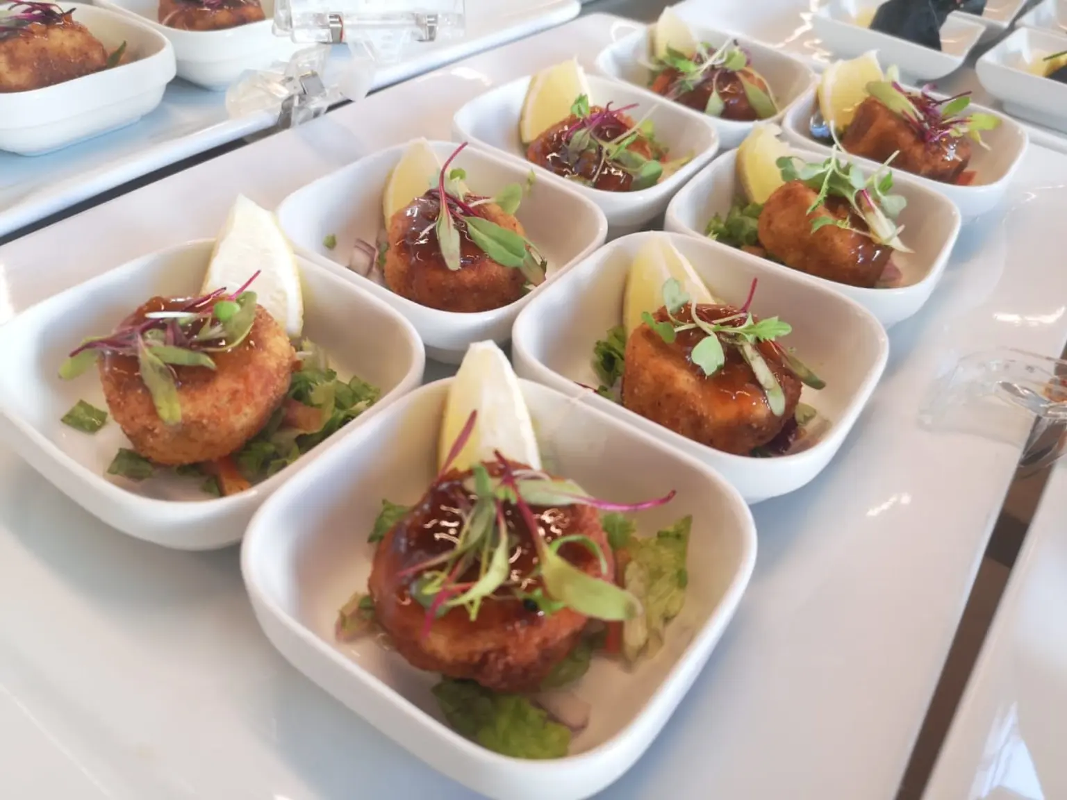 Plated canapés with microgreens and lemon