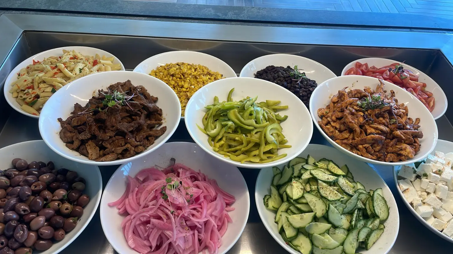 Workplace salad bar with a range of fresh ingredients