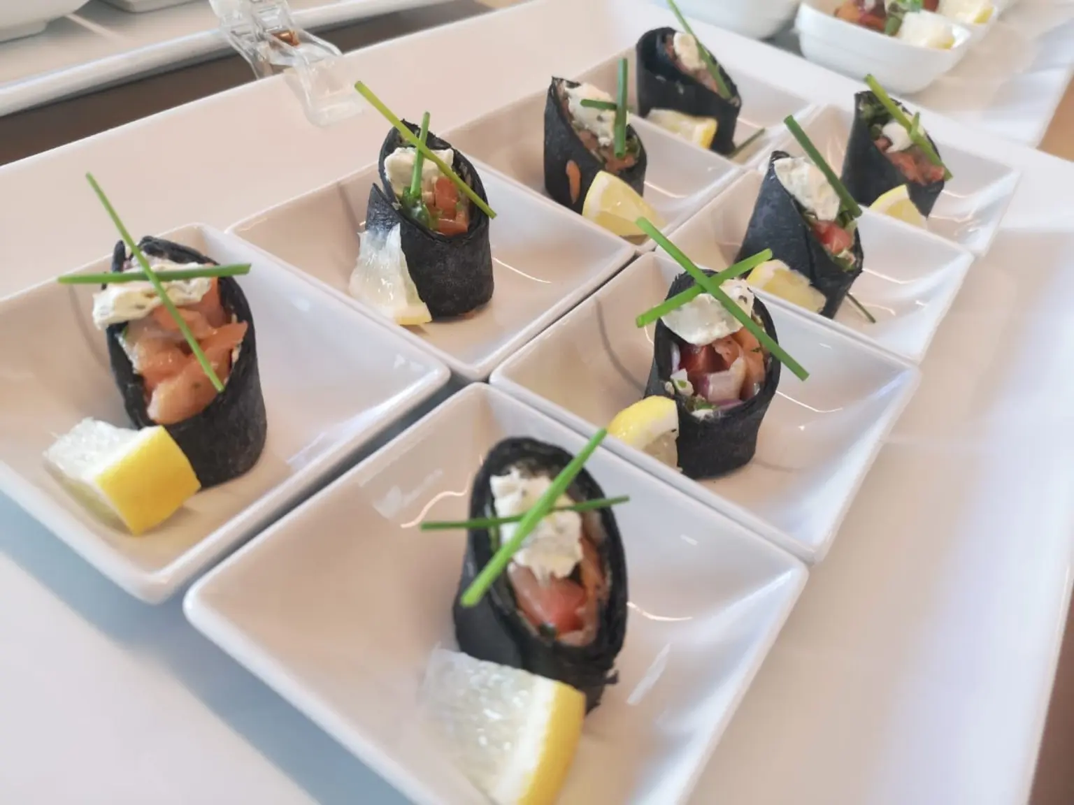 Salmon and nori appetisers in individual bowls
